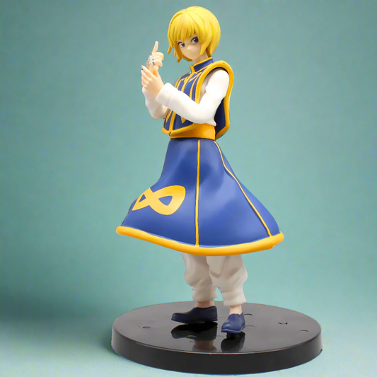 Figure of a character in a blue and yellow outfit with an '∞' symbol on a green background