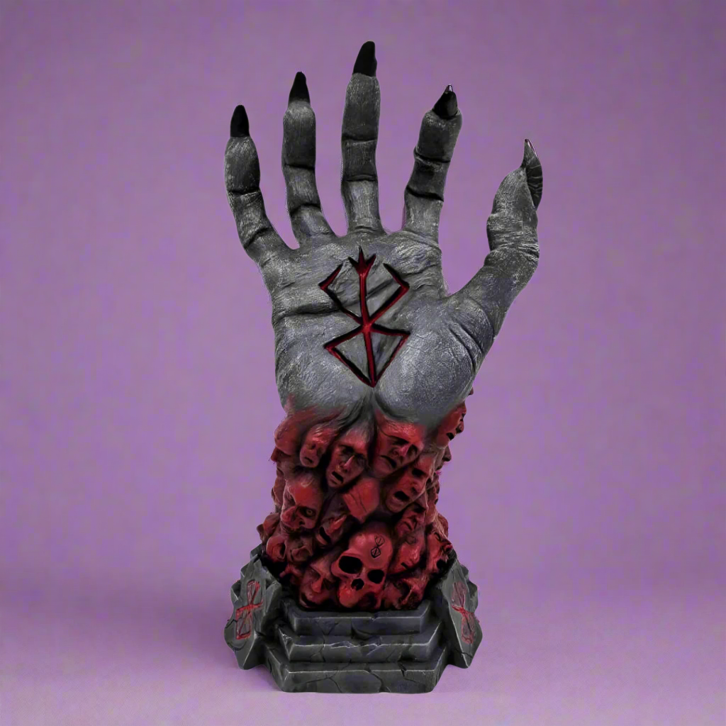 Decorative hand with black nails, red interior, and skull design on a white background