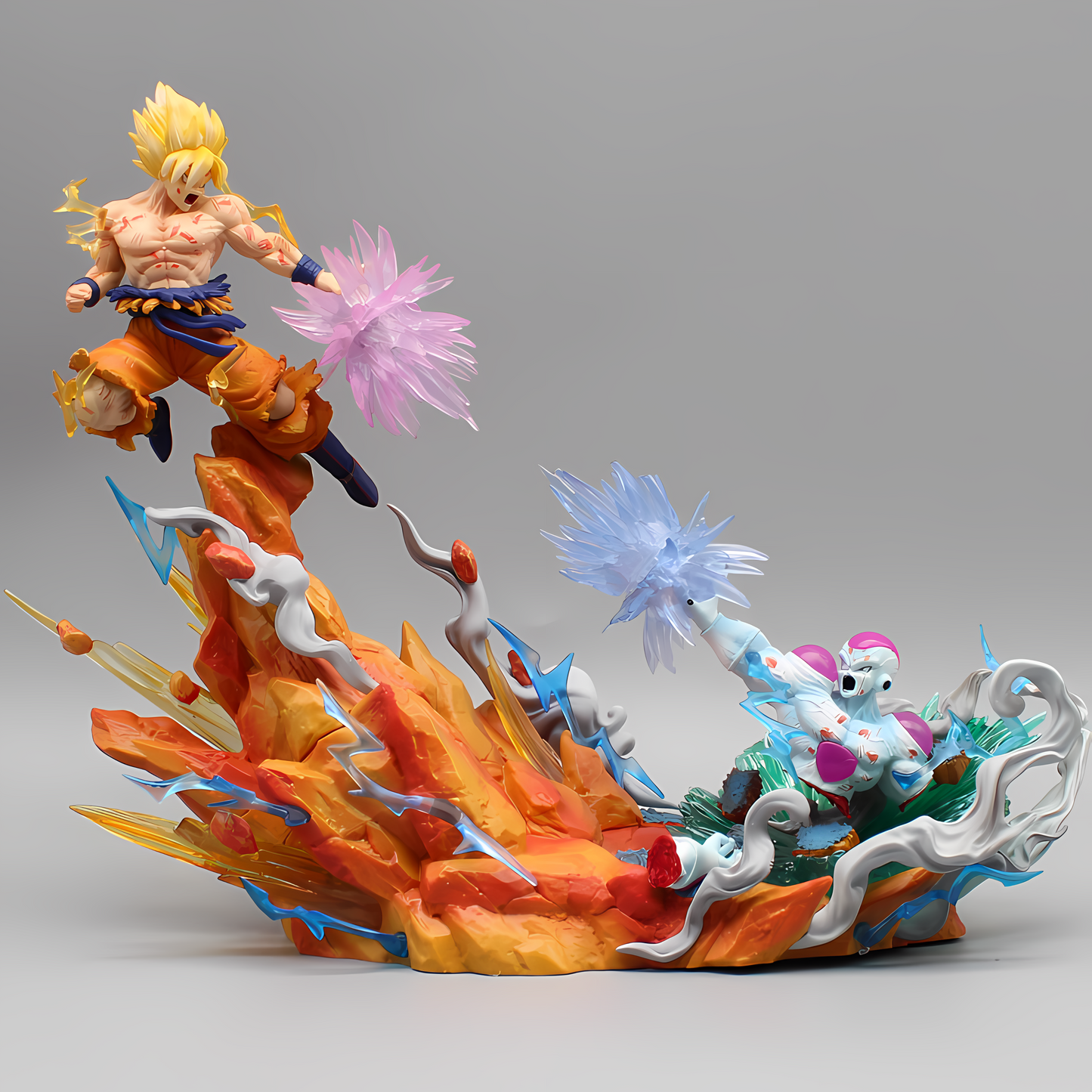 The Dragon Ball collectible 'Clash of Titans Goku vs. Frieza' captures an iconic battle with Goku in Super Saiyan form, poised for combat above a fiery orange and red eruption, while Frieza unleashes an icy blue attack below. This detailed figurine highlights the fierce energy and motion of the fight, set against a neutral background to draw attention to the vibrant action.
