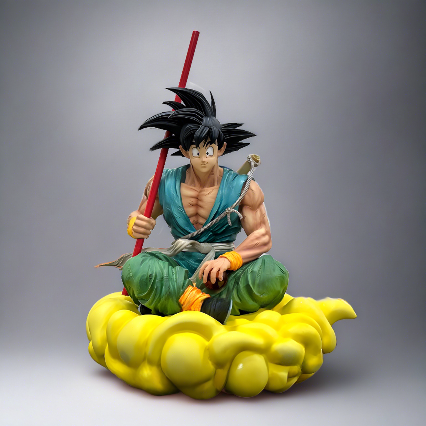 Side view of a Goku figure from Dragon Ball, displaying his iconic teal gi and Power Pole, as he rides the nimbus cloud with determination.