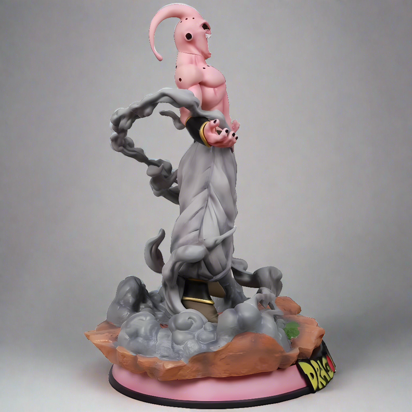 Majesty Majin-Buu figure captured in a dynamic pose with smoke-like tendrils swirling around, highlighting his pink skin and relaxed demeanor.
