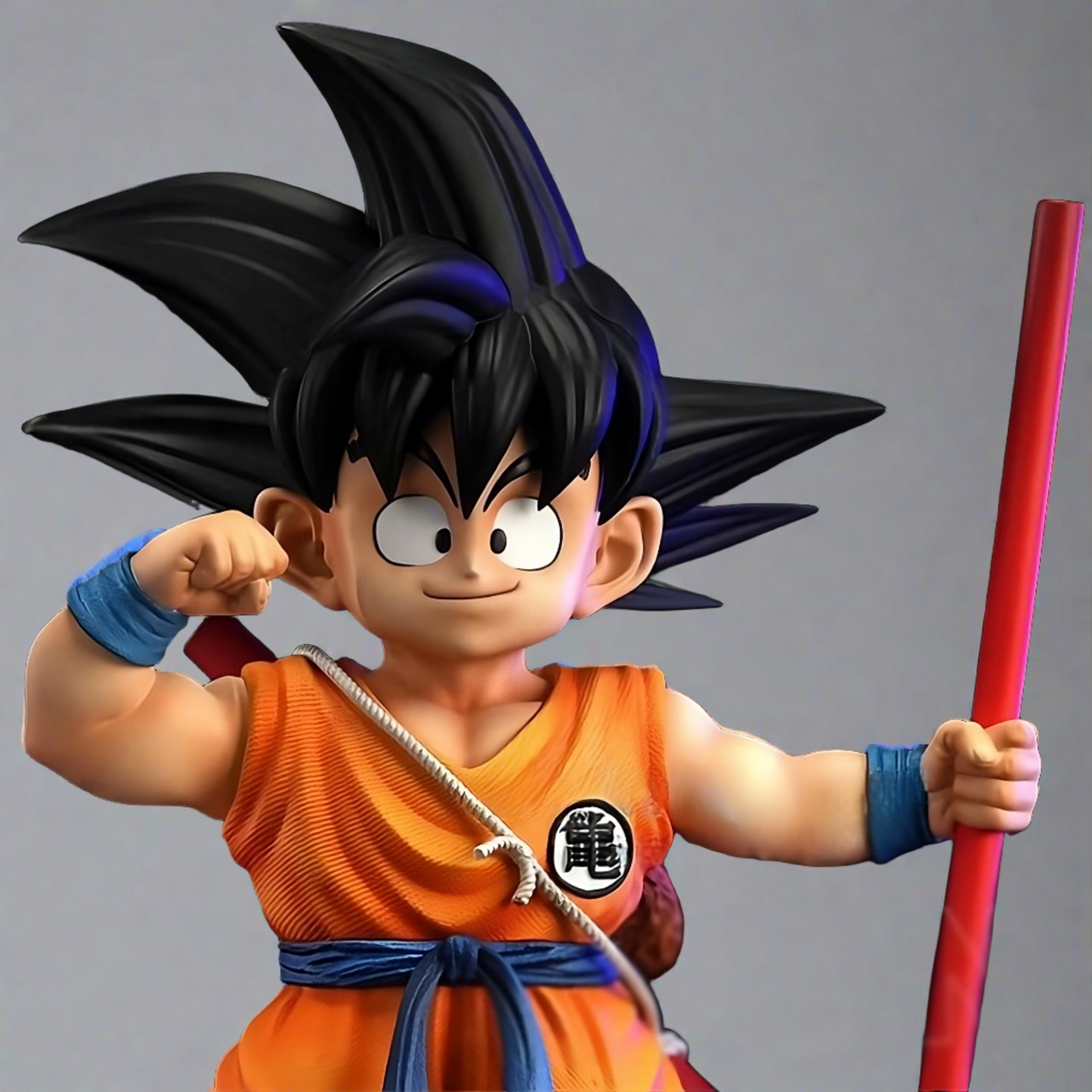 Close-up of the collectible Dragon Ball figure of young Goku, featuring his cheerful expression and spiky hair, complete with his Power Pole and detailed attire."