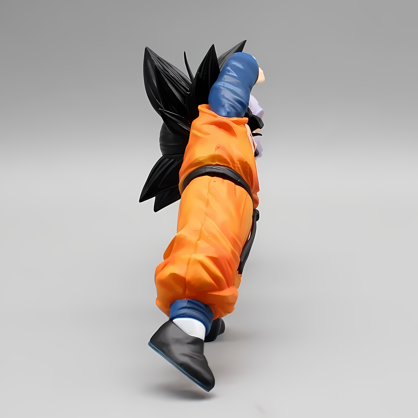 Dragon Ball collectible figure of Goten and Trunks, positioned head-to-head in the fusion dance, a dramatic representation of their powerful bond and unity.