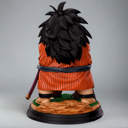 A detailed Yajirobe figurine from Dragon Ball Z, viewed from the side, featuring his crossed arms, a sheathed katana, and boots beside a campfire, all atop a themed base, against a dark background.