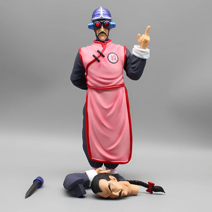 Tao Pai Pai action figure posed with an index finger raised, standing over a defeated adversary, capturing a moment of triumph in a collectible Dragon Ball scene.