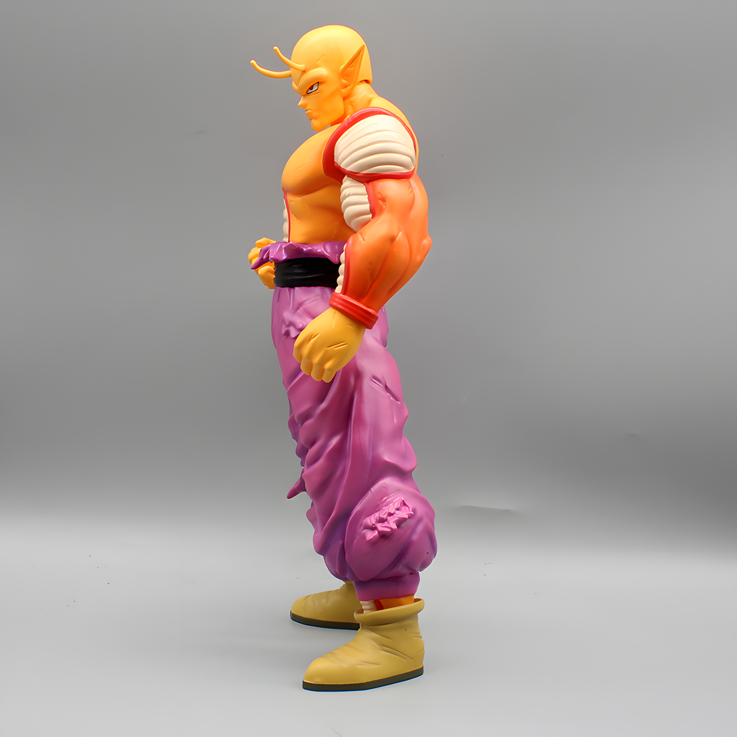 Side view of the Piccolo Dragon Ball figure, illustrating his concentrated expression and the draped purple garment, ready for battle.