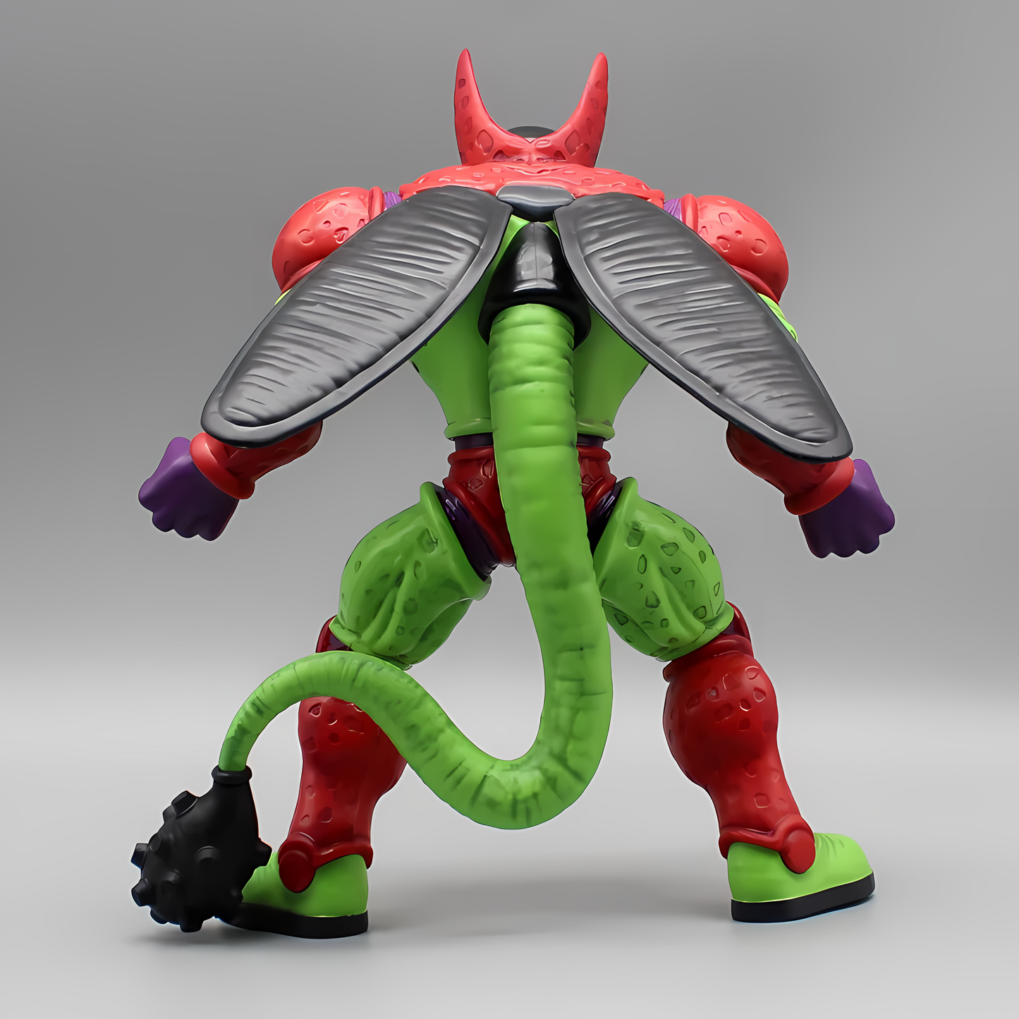 Back perspective of the Dragon Ball 'Cell Max' collectible figure, highlighting the character's unique spotted green skin and intricate red wings.