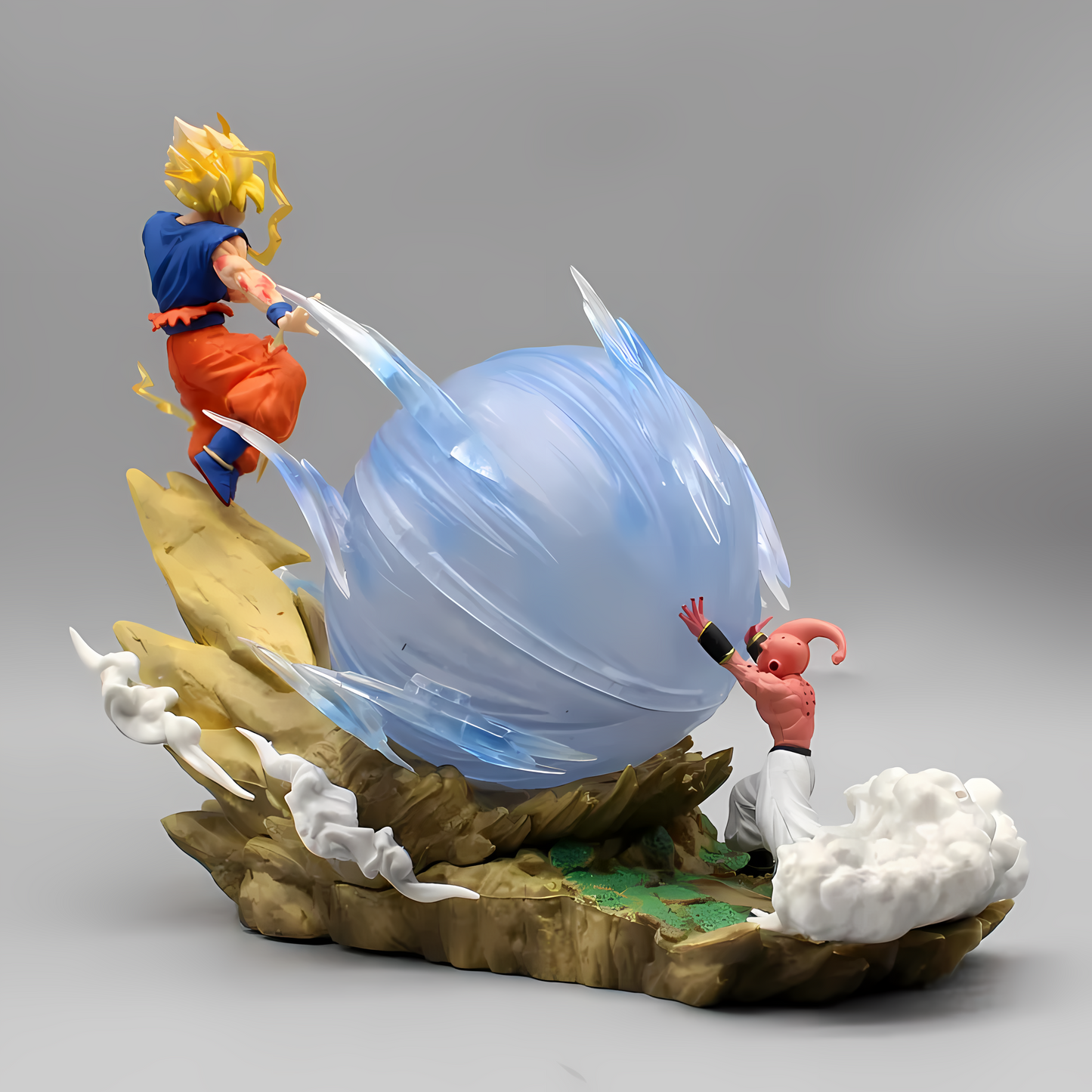 Action figure of Goku evading an energy attack by Majin Buu, captured from a side angle, highlighting the dynamic motion and energy impact.