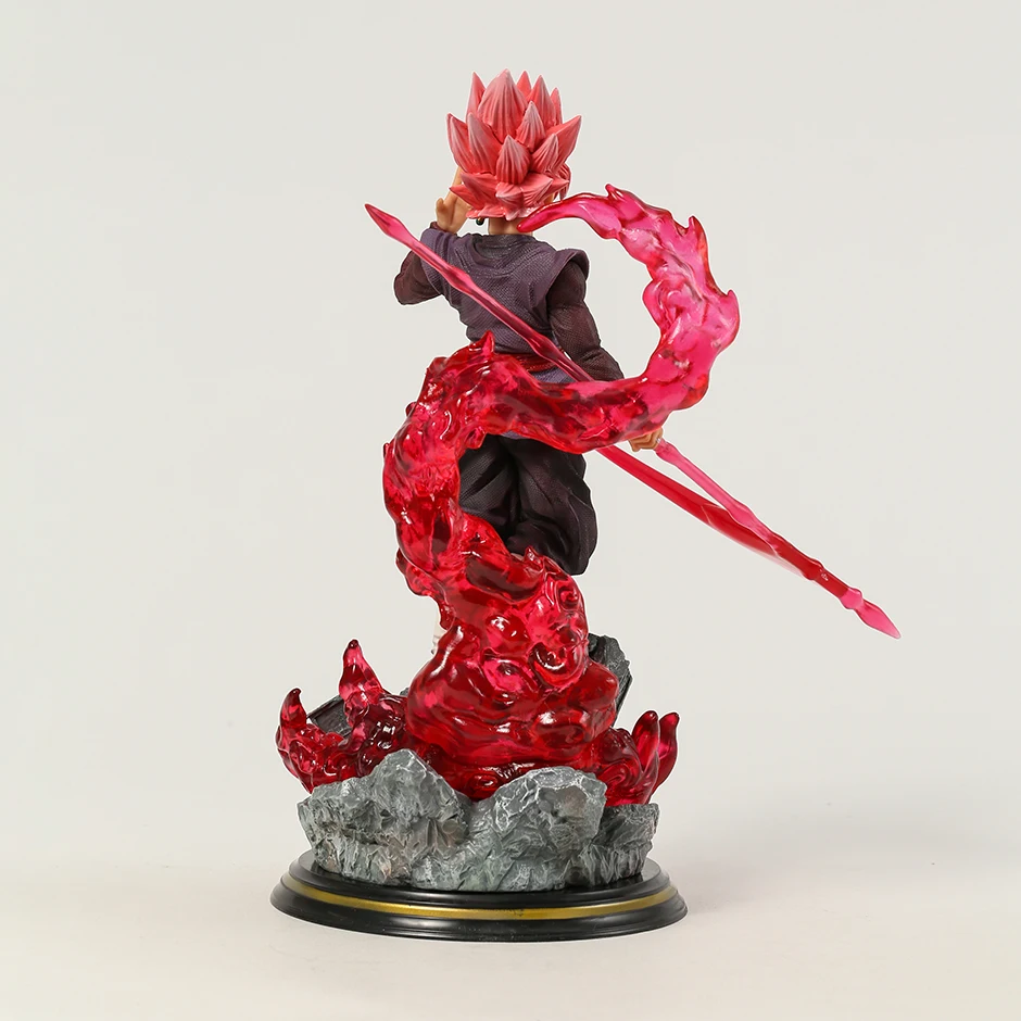 The Dragon Ball collectible figure 'Black Goku Rises' depicts Goku Black in Super Saiyan Rose form, brandishing an energy scythe with a swirl of red energy around him. The dynamic pose, detailed costume, and the intense swirl of energy showcase the character's power and elegance, with the DRAGON BALL logo on the base affirming its authenticity as a prized piece for collectors.