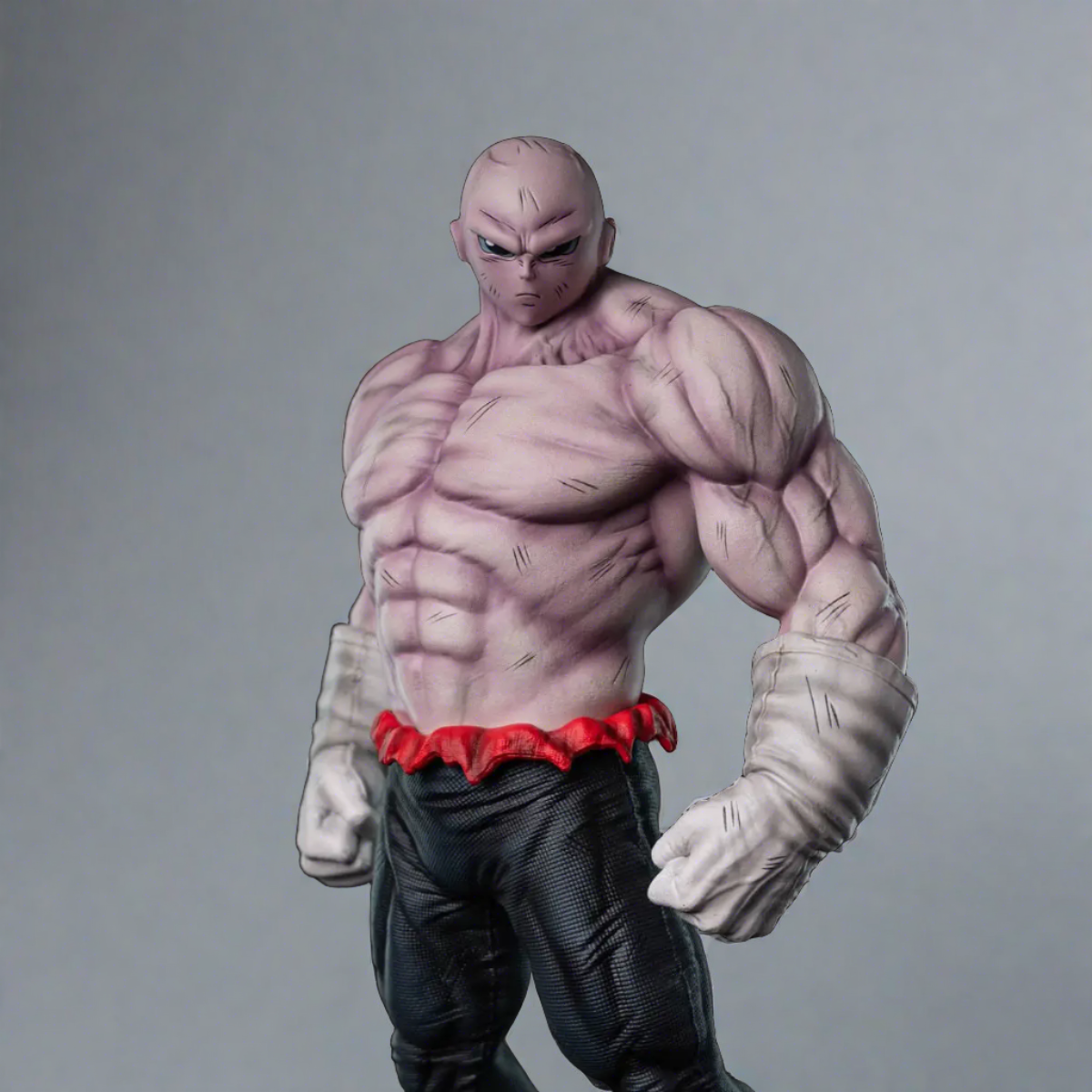 Dragon Ball Super Jiren figurine, presented from the front, with a focused expression and an imposing stance, displaying his striking musculature and signature red and gray attire, ideal for collectors of anime memorabilia.