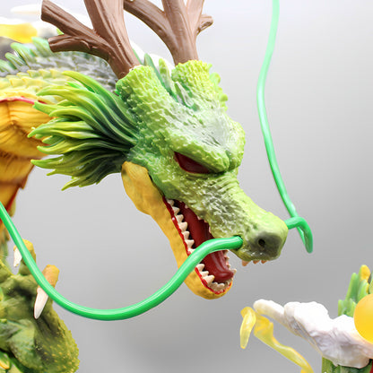 Extreme close-up of the Shenron dragon head from the Dragon Ball Z series collectible figurine, highlighting the intricate details of its textured green scales, sharp teeth, and intense red eyes. The lifelike craftsmanship captures Shenron's ferocious expression and flowing mane, with a neutral gray background that accentuates the vivid colors and detailed design.