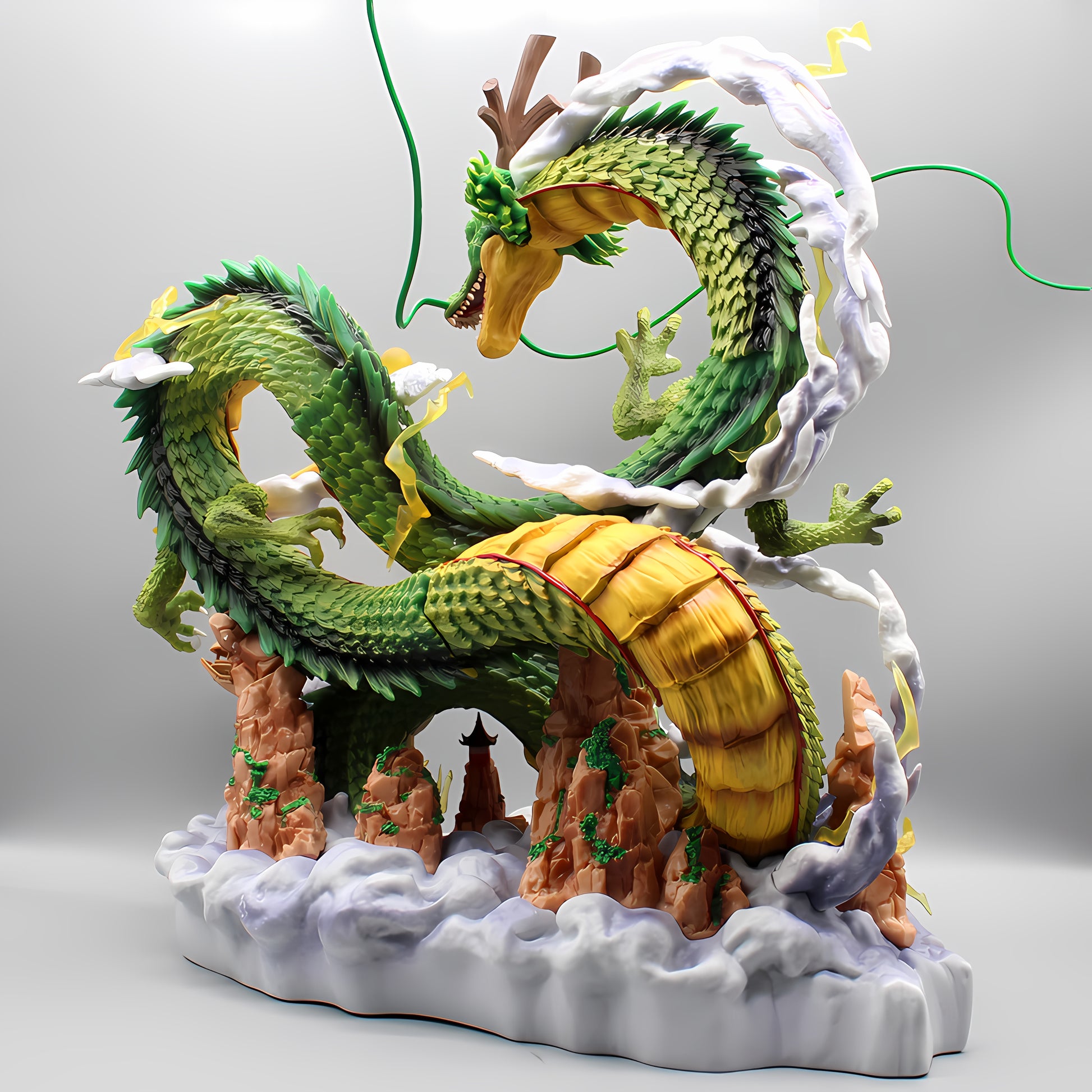 This collectible figurine captures Shenron from Dragon Ball Z in a moment of mystical majesty, with its green and yellow scaled body sinuously curving around a rocky base amid billowing white clouds. The attention to detail is evident in the dragon's fearsome expression and the delicate work on the rocks and clouds, all set upon a subtle grey gradient background, enhancing the three-dimensionality of the statue.