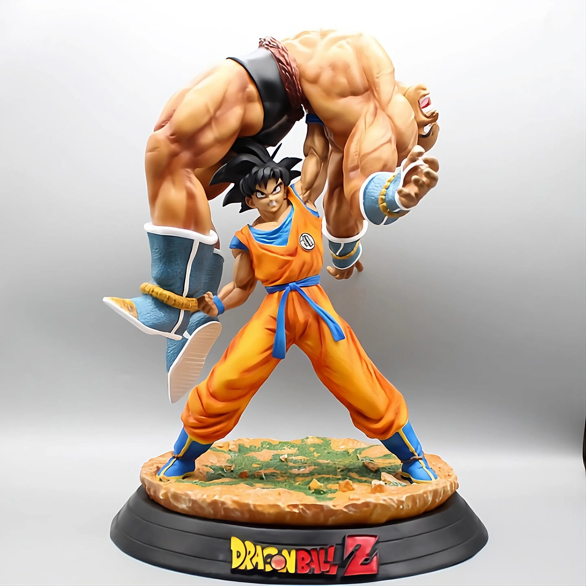 Dragon Ball Z collectible figure capturing the intense moment with Goku overpowering Nappa, depicted with detailed musculature and dynamic action pose.