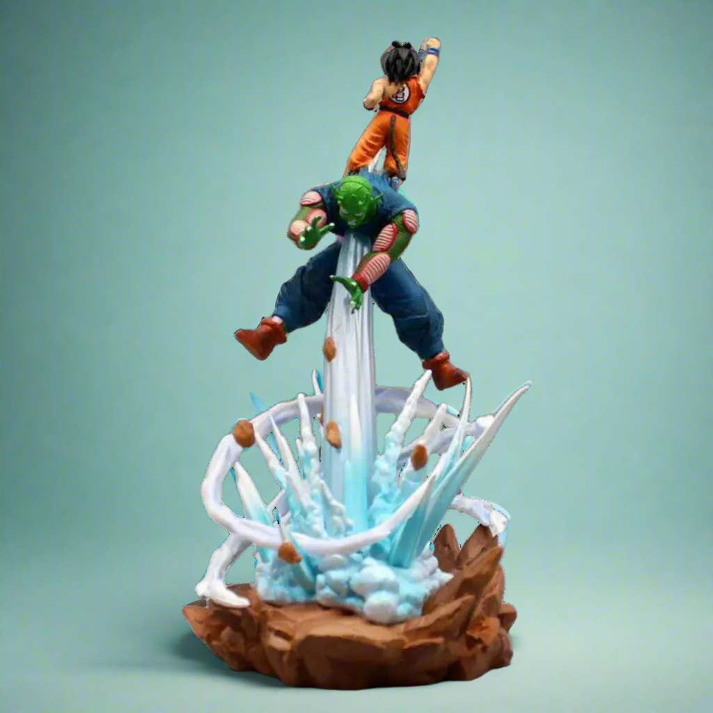 Dynamic Dragon Ball figure of Goku and Piccolo launching an attack with energy effects and rocky base.