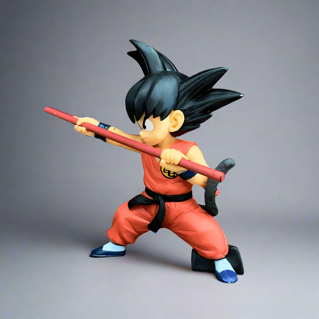 A dynamic pose of the 'Adventures Begin' Goku figure from Dragon Ball, with the iconic Power Pole, capturing the spirit of adventure against a backdrop of flames and clouds.