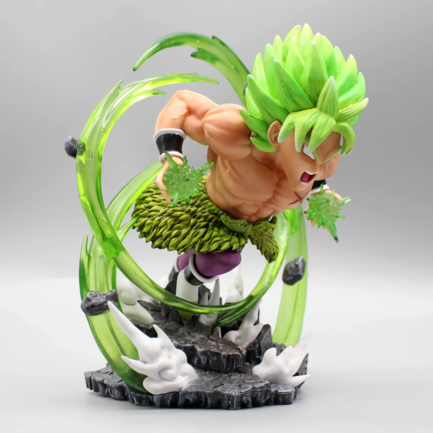 Full display of the Dragon Ball collectible depicting Broly in a battle pose with green energy effects, on a detailed rock-like base.