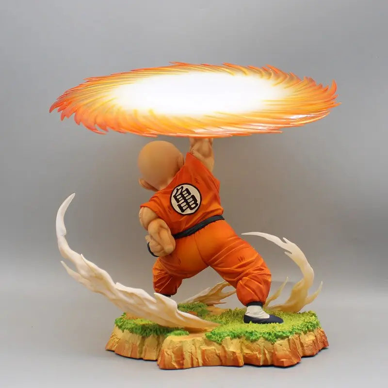 Dragon Ball Z collectible statue featuring Krillin in mid-action, performing the powerful Destructo Disc with a bright energy effect, positioned on a detailed landscape base, creating an eye-catching depiction of his signature technique.