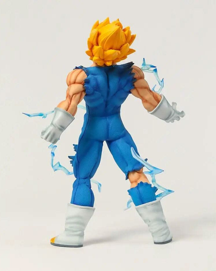 Rear view of a Majin Vegeta figurine from Dragon Ball Z, displaying his torn blue battle suit and muscular build, with his Super Saiyan hair radiating power and energy effects swirling around him, epitomizing his fierce fighting spirit.