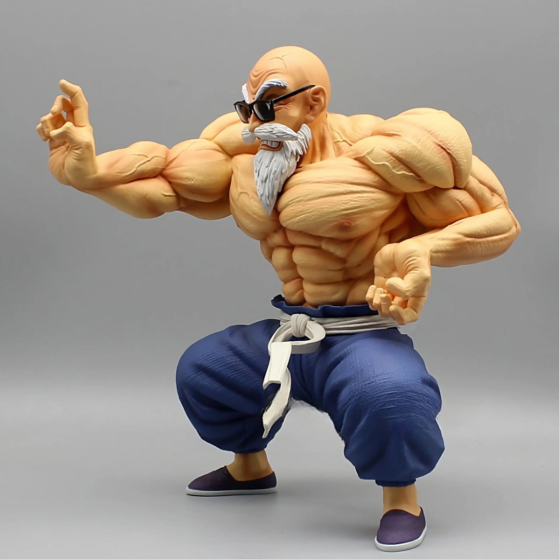 Muscle Master Roshi figure from Dragon Ball, angled to the side, showcasing his bulging muscles and combat-ready stance.