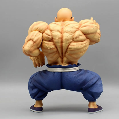Back view of the Master Roshi collectible figure, highlighting his muscular back and bald head, set against a neutral backdrop.