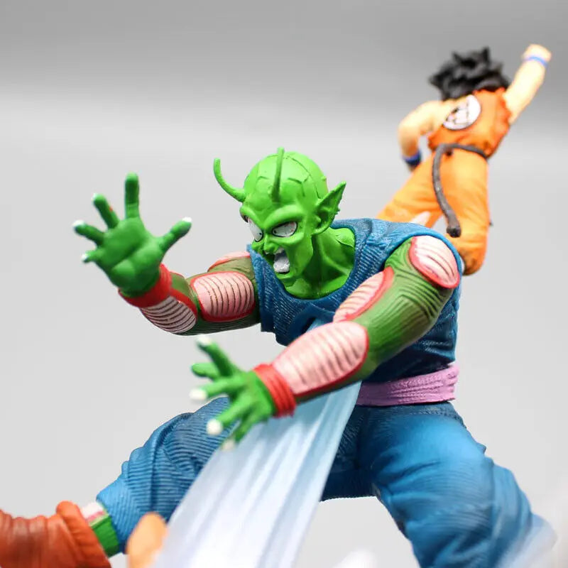 Detailed close-up of a Piccolo action figure in a defensive stance from Dragon Ball, against a soft-focus background featuring Goku in an attacking position.